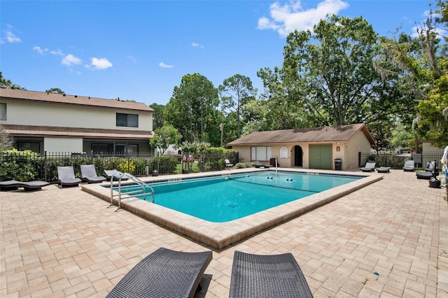 view of swimming pool featuring a patio