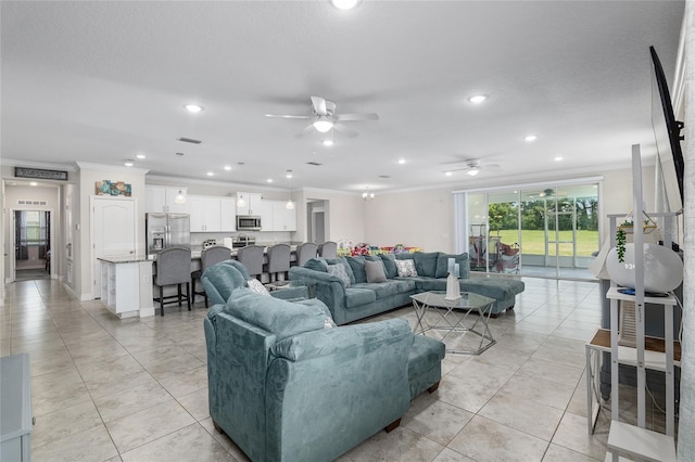 tiled living room featuring ornamental molding and ceiling fan