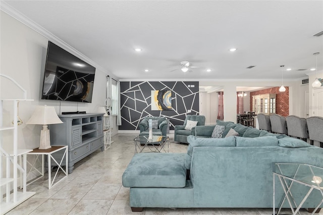 tiled living room with ceiling fan and ornamental molding