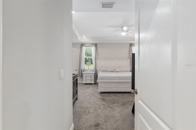 bedroom featuring light carpet and ceiling fan