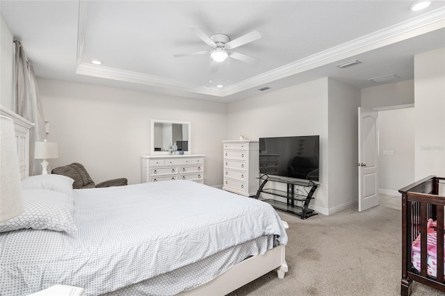 bedroom featuring carpet floors, ceiling fan, a raised ceiling, and crown molding