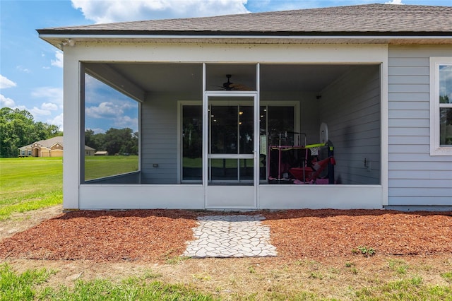 entrance to property featuring ceiling fan