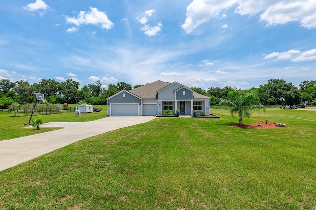 single story home featuring a garage and a front lawn