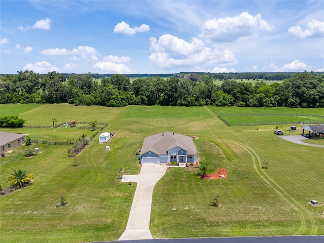 birds eye view of property with a rural view