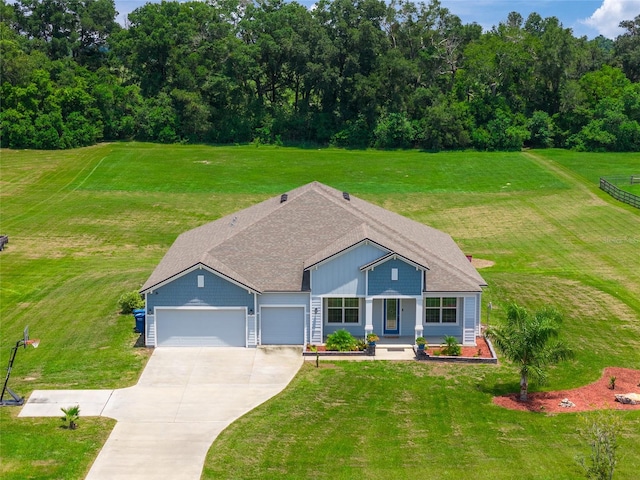 view of front of house featuring a garage and a front yard