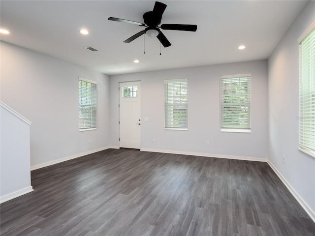 interior space with dark wood-type flooring and ceiling fan