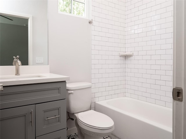 full bathroom featuring vanity, toilet, and tiled shower / bath