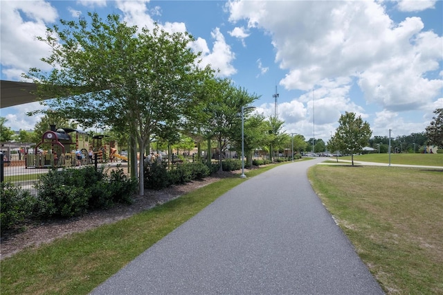 view of home's community with a yard