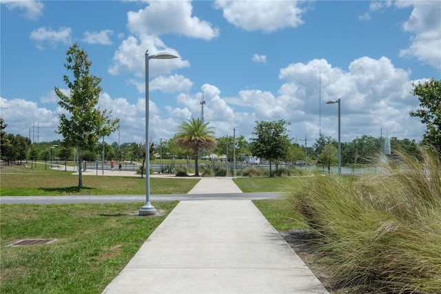 view of property's community featuring a yard