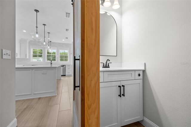 bathroom with tile patterned flooring and vanity