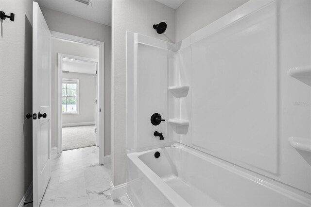 bathroom with shower / bath combination and tile patterned floors