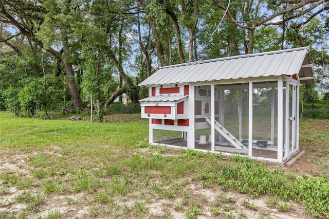 view of outbuilding with a lawn