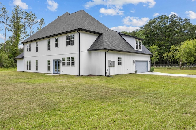 exterior space featuring a garage and a yard