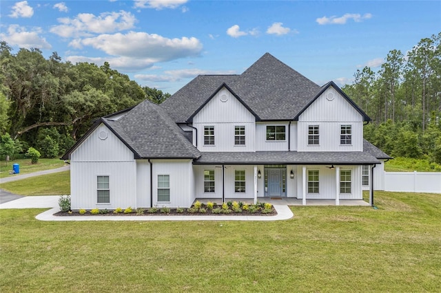 modern farmhouse featuring a front yard