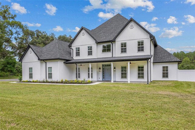 modern inspired farmhouse with a front lawn