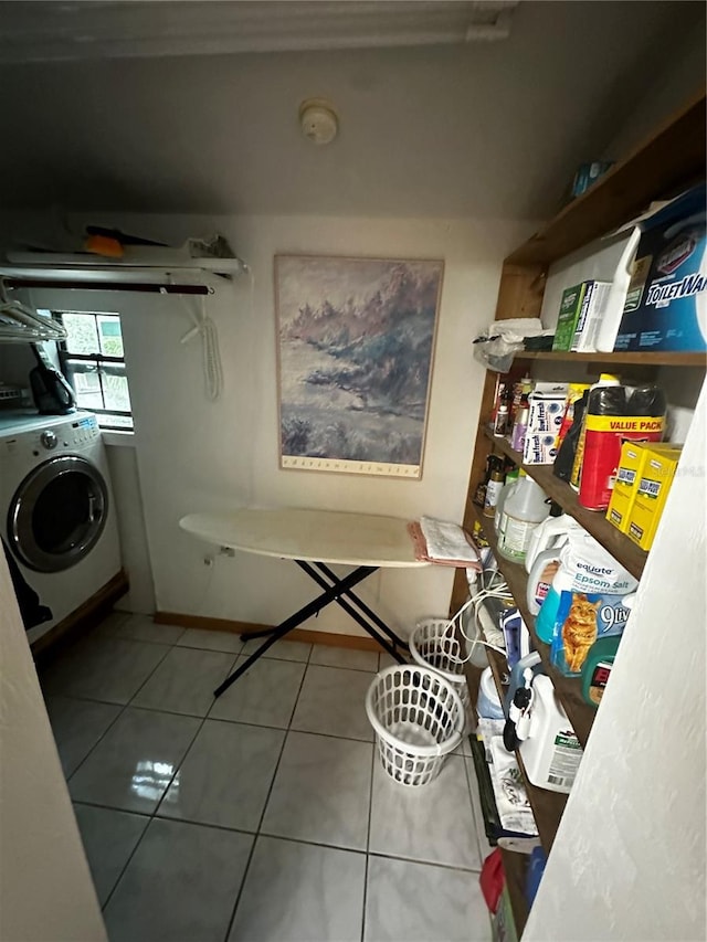 laundry room featuring tile patterned floors and washer / clothes dryer