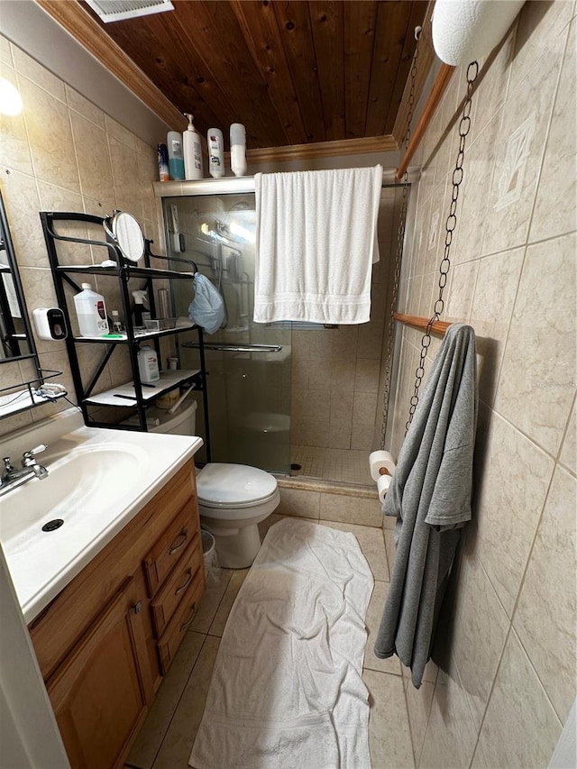 bathroom with tile walls, vanity, a shower with shower door, wooden ceiling, and toilet