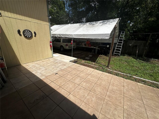 4215 NW 10th St, Gainesville, FL 32609 - view of patio / terrace with fence and a carport