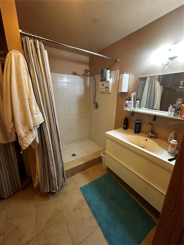 bathroom with vanity, tile patterned flooring, and a shower with shower curtain