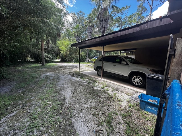 view of car parking featuring a carport