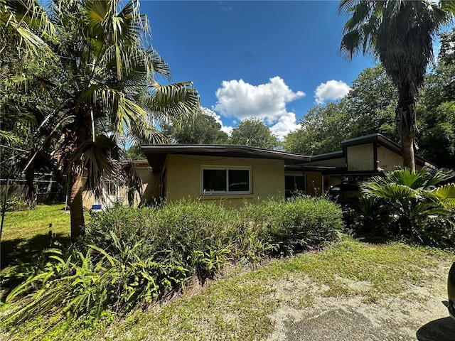 4215 NW 10th St, Gainesville, FL 32609 - view of side of property with stucco siding