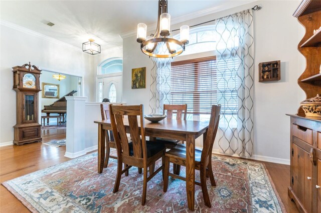 dining space featuring a wealth of natural light and hardwood / wood-style flooring