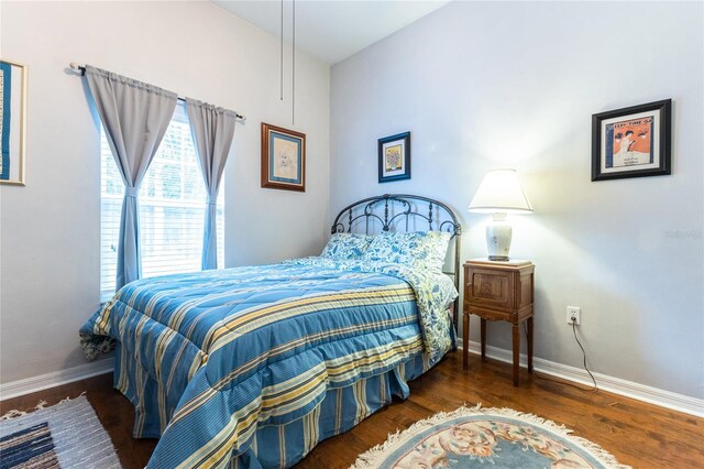 bedroom featuring dark hardwood / wood-style flooring