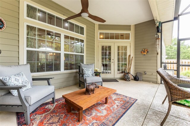 sunroom featuring french doors, ceiling fan, and plenty of natural light