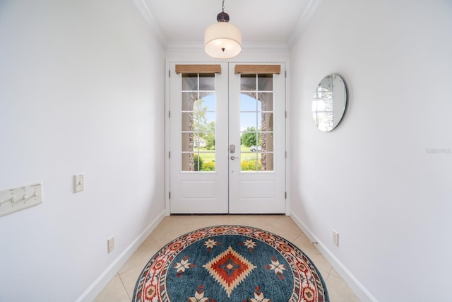 entryway with french doors, light tile patterned flooring, and ornamental molding