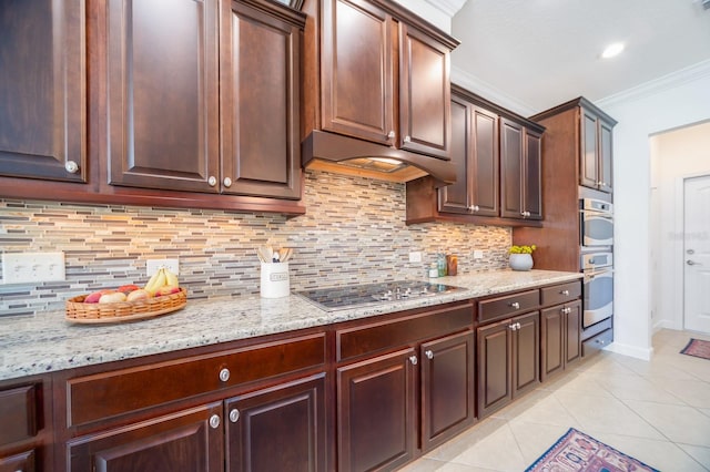 kitchen with cooktop, decorative backsplash, ornamental molding, and light stone counters