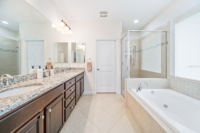 bathroom with vanity, tile patterned flooring, and shower with separate bathtub