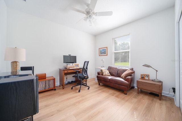 office space with ceiling fan and light hardwood / wood-style flooring