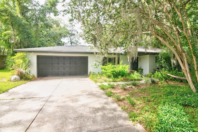 ranch-style home featuring a garage