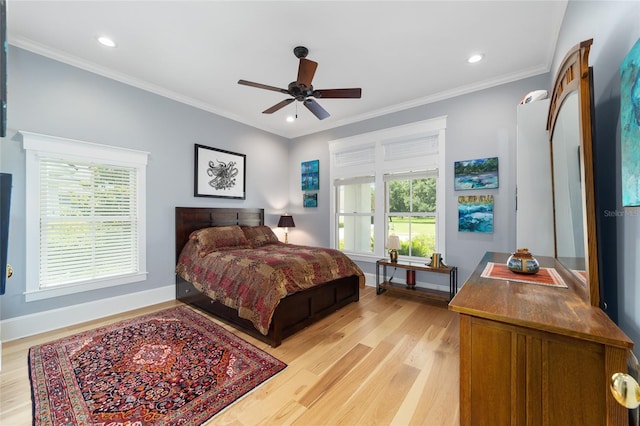 bedroom with baseboards, ornamental molding, recessed lighting, and light wood-style floors