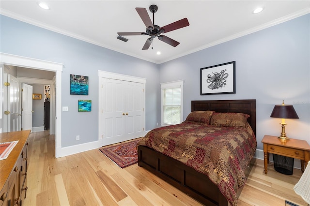 bedroom with recessed lighting, baseboards, ornamental molding, a closet, and light wood finished floors