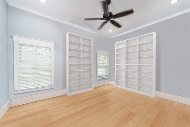 unfurnished room with hardwood / wood-style flooring, ornamental molding, ceiling fan, and built in shelves