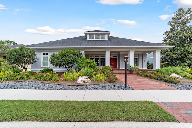 view of front of home featuring a porch and stucco siding