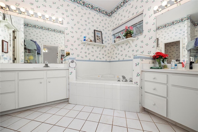 bathroom with vanity, tiled bath, and tile patterned floors