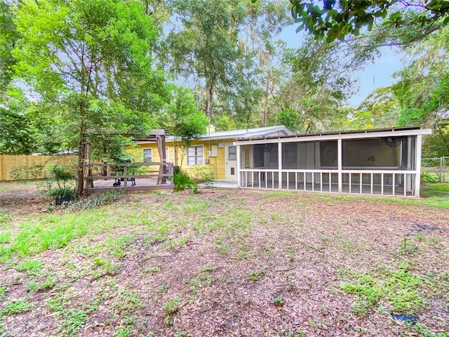 rear view of house with a sunroom