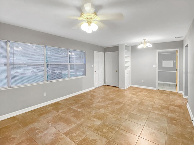 unfurnished room with ceiling fan and light tile patterned floors