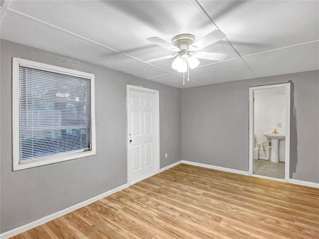 empty room featuring light hardwood / wood-style flooring and ceiling fan