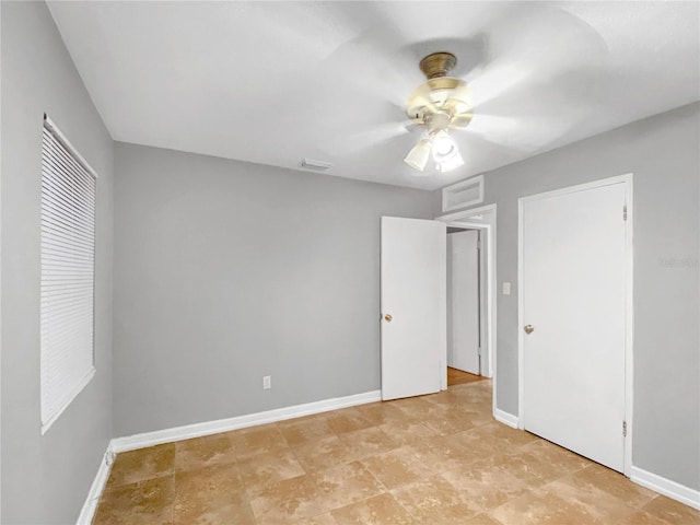 unfurnished bedroom featuring tile patterned flooring and ceiling fan