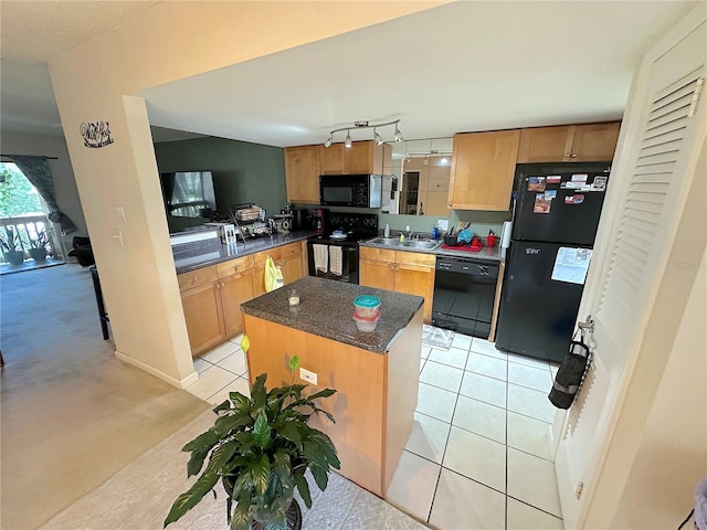 kitchen featuring a center island, black appliances, rail lighting, and light tile patterned floors