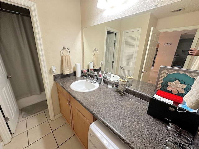 bathroom with vanity and tile patterned flooring