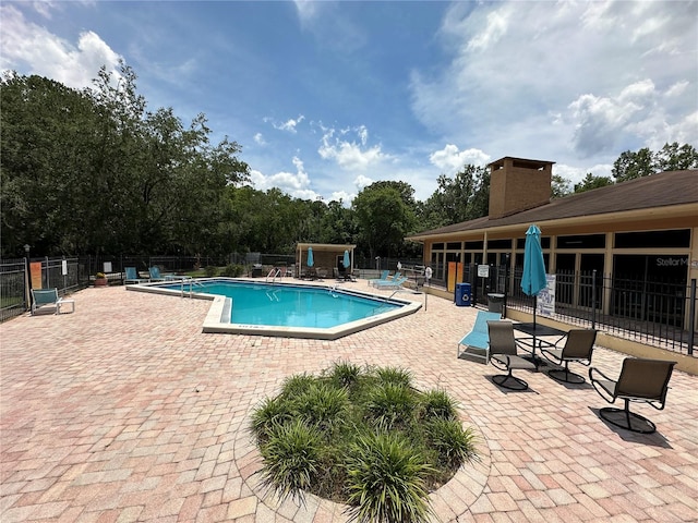 view of swimming pool featuring a patio