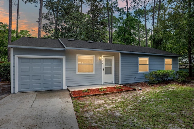 ranch-style home with a garage