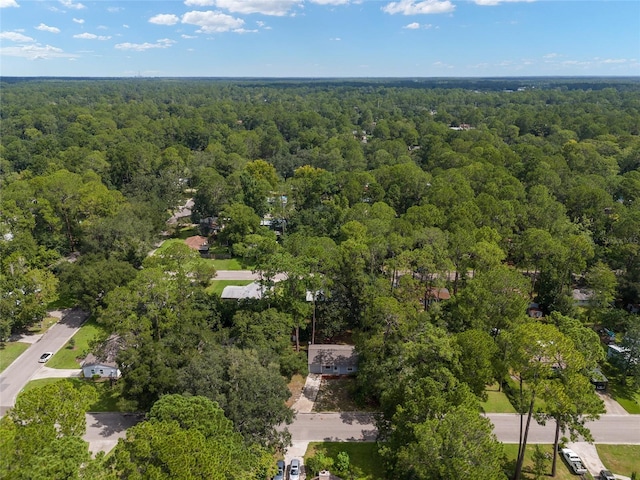 aerial view featuring a wooded view