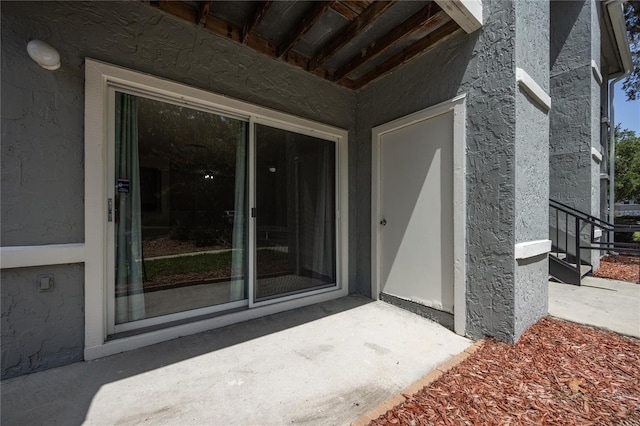 doorway to property featuring a patio