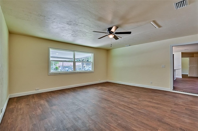 unfurnished room with dark wood-type flooring and ceiling fan