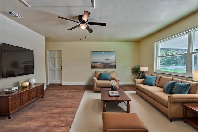 living room featuring hardwood / wood-style flooring and ceiling fan